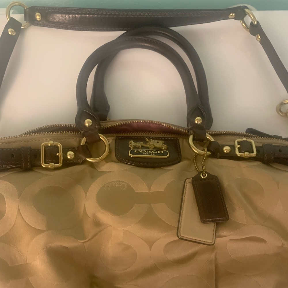 Tan cloth bag coach